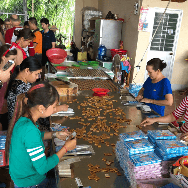 Making coconut candy in Ben Tre Vietnam tour package